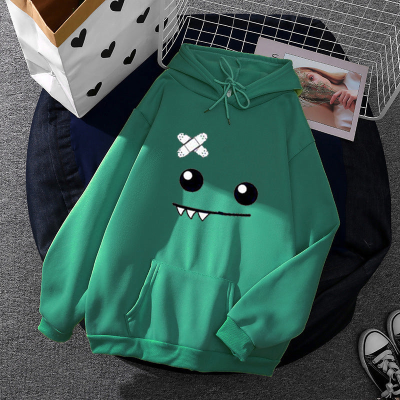 Women's hoodie with playful monster design Chic & Stil
