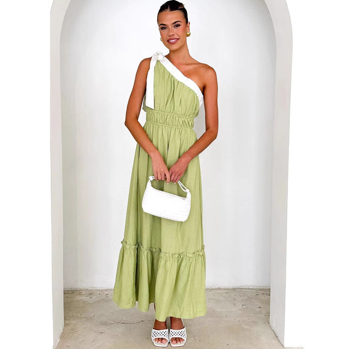 Women's maxi dress with asymmetrical shoulder design and flowing pleated skirt