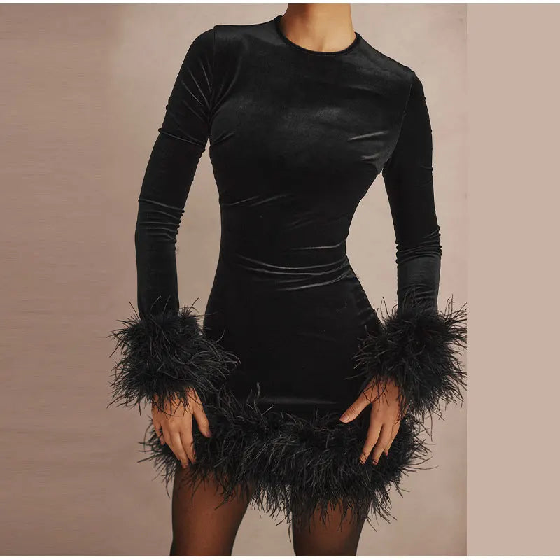 Lune London | Elegant fitted dress with feather embellishments on the sleeves