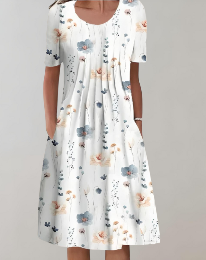 Lune London | Short sleeves, loose midi dress with floral pattern and pockets