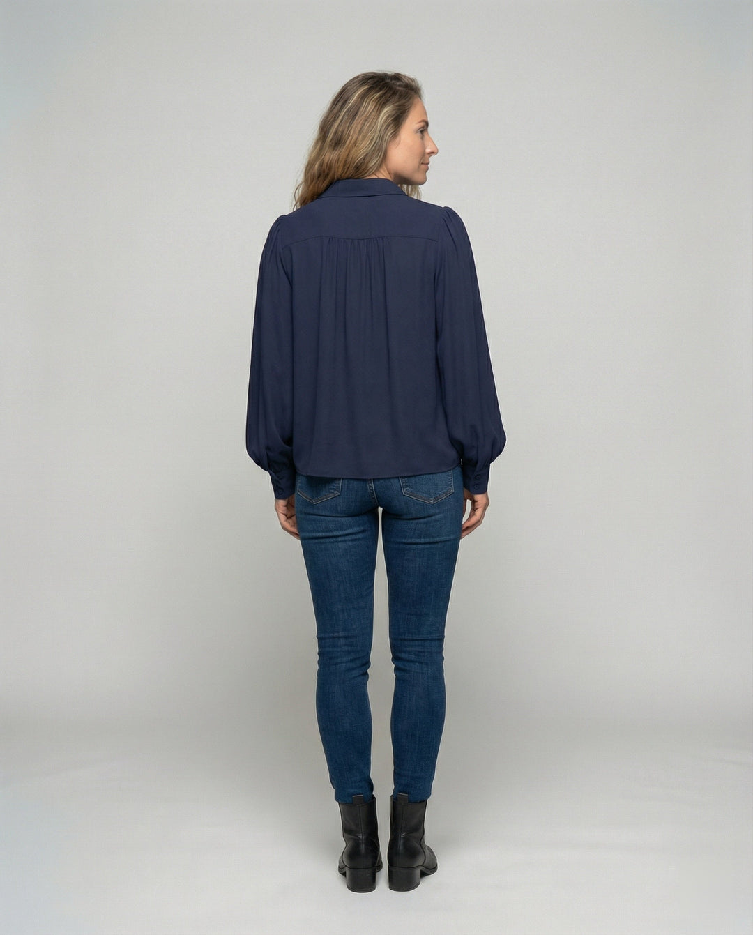 Ladies blouse with voluminous sleeves and elegant ruffle details