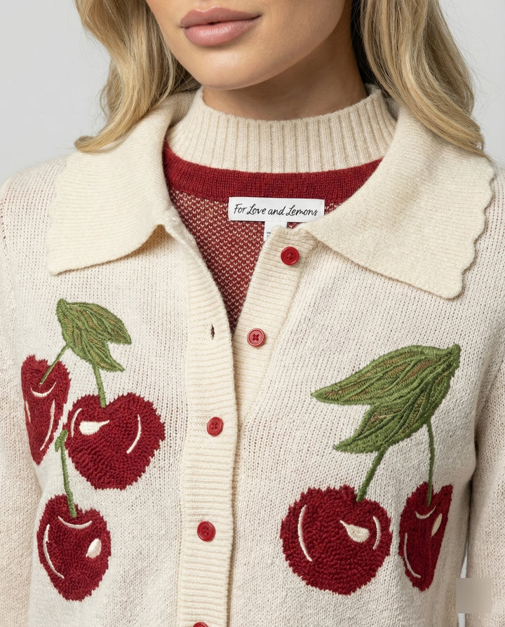 Ladies cheerful Cropped knitted jacket with cherry blossom floral pattern Lune London