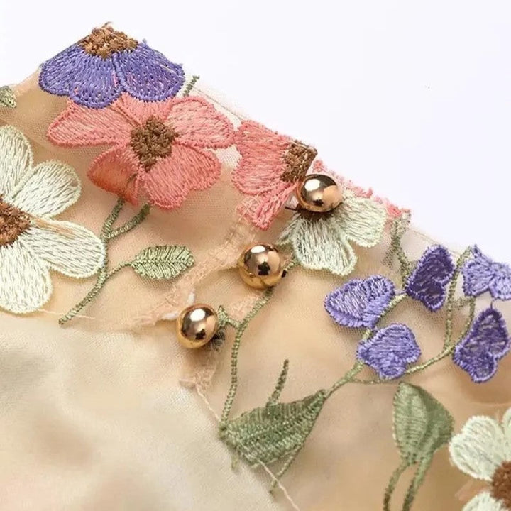 Lune London | Mini dress with floral appliqués and a sheer look