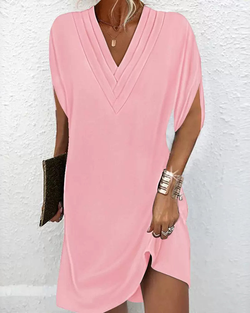 Chic und Stil | Elegant dress with slitted sleeves